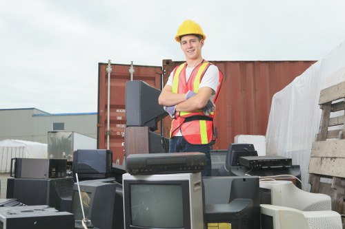 Workers segregating waste for recycling during an office clear-out